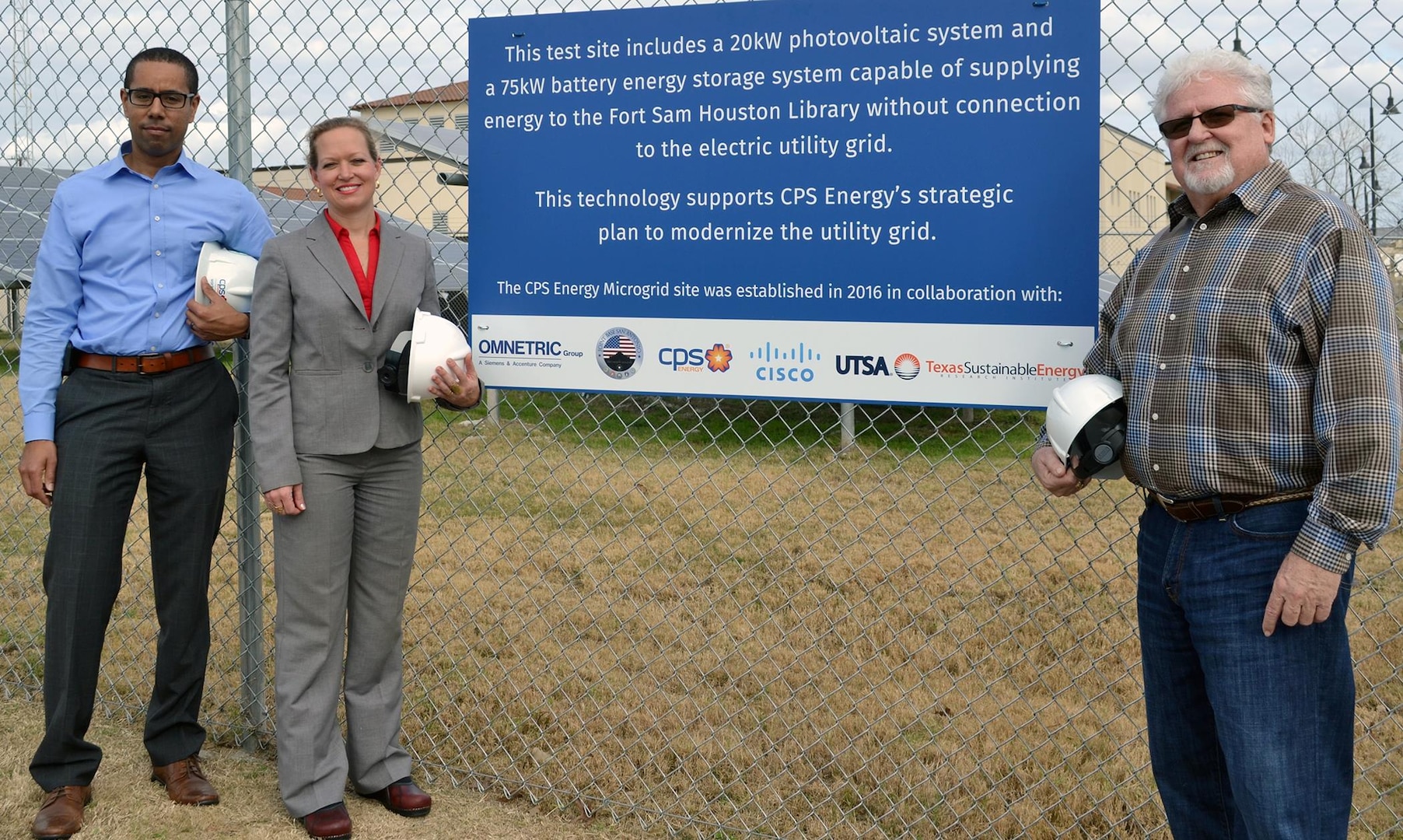 Joint Base San Antonio and CPS Energy are involved in an innovative partnership to do research on the uses and effectiveness of microgrid technology at a test site at the JBSA-Fort Sam Houston Campbell Memorial Library. Standing at the test site Jan. 13 are (from left) James Boston III, CPS Energy manager of market intelligence; Brenda Roesch, 502nd Civil Engineer Squadron JBSA engineer; and Frank Thomas, 502nd Civil Engineer Squadron JBSA resource efficiency manager.
