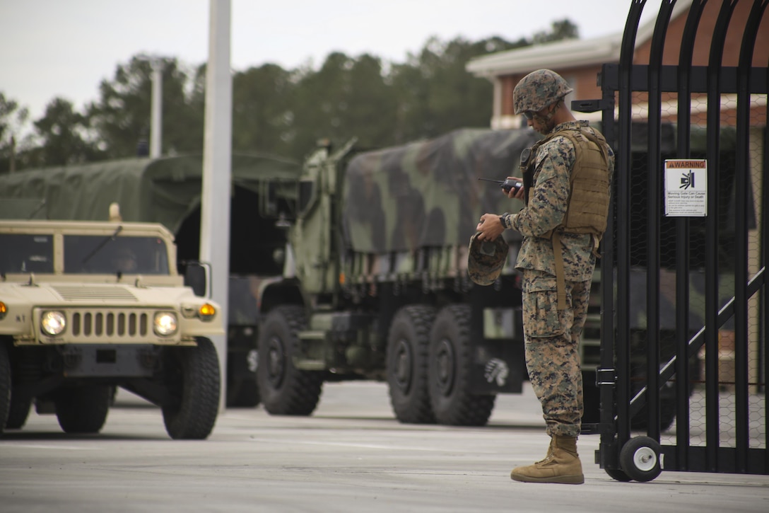 A Marine communicates with vehicles in a convoy during a Strategic Mobility Exercise aboard Marine Corps Air Station Cherry Point, N.C., Jan. 20, 2017. Marines assigned to Marine Air Support Squadron 1, Marine Air Control Group 28, 2nd Marine Aircraft Wing simulated troop movement in response to a limited/ no-notice mock deployment of a Direct Support Center with extensions in support of overseas contingency operations. Marines must maintain their ability to react effectively and in a timely matter when called upon to support operations anywhere in the world.  (U.S. Marine Corps photo by Sgt. N.W. Huertas/ Released)