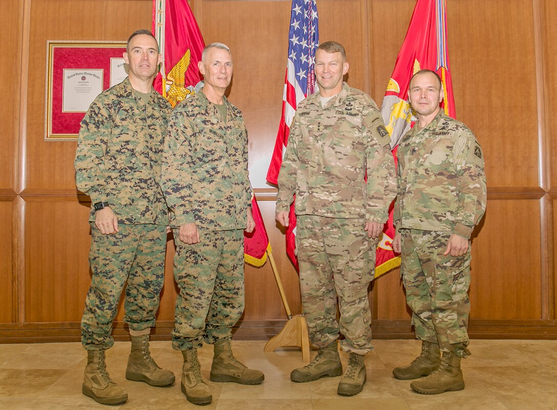 Sgt. Maj. Patrick L. Kimble (left), sergeant major of Marine Forces Reserve and Marine Forces North, Lt. Gen. Rex C. McMillian (second from-left), commander of MARFORRES and MARFORNORTH, pose for a photo with Lt. Gen. Jeffrey S. Buchanan (second from-right), commander of United States Army North (Fifth Army) and senior commander, Fort Sam Houston and Camp Bullis, and Command Sgt. Maj. Ronald E. Orosz, command sergeant major U.S. Army North (Fifth Army) and senior enlisted leader, Fort Sam Houston and Camp Bullis, at Marine Corps Support Facility New Orleans, Jan. 24, 2017. Buchanan stopped by the facility on his way to Joint Readiness Center aboard Fort Polk, La., to meet with McMillian and to attend a MARFORNORTH command brief. 
