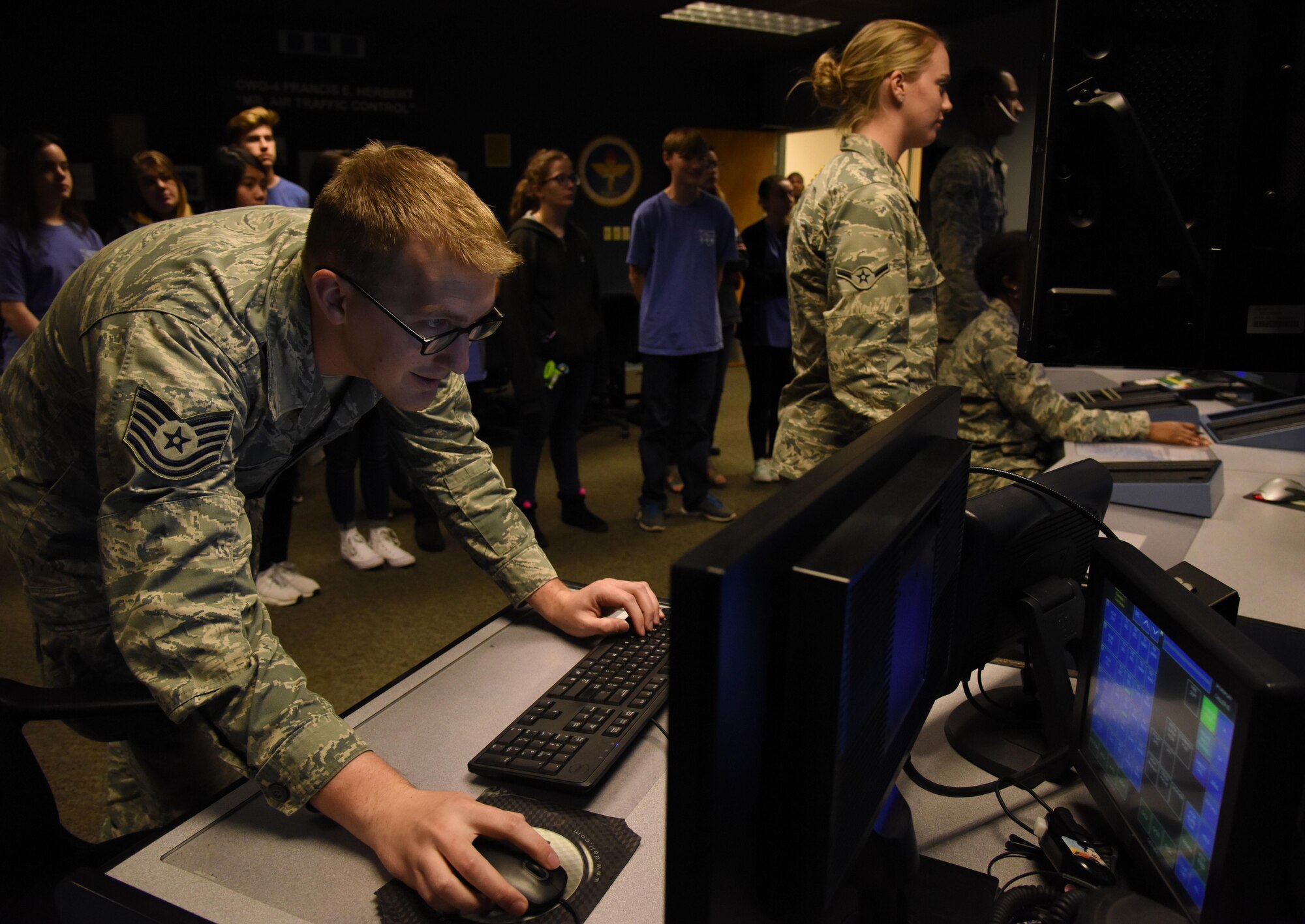 Tech. Sgt. William Olson, 334th Training Squadron instructor, operates the air traffic control tower simulator at Cody Hall during the Biloxi Chamber of Commerce Gulf Coast Junior Leadership Tour Jan. 24, 2017, on Keesler Air Force Base, Miss. The group’s objective is to produce students of outstanding character, while teaching them about community needs and what it takes to become a leader in today’s society. The visit also included a military training leader briefing and a dorm tour. (U.S. Air Force photo by Kemberly Groue) 