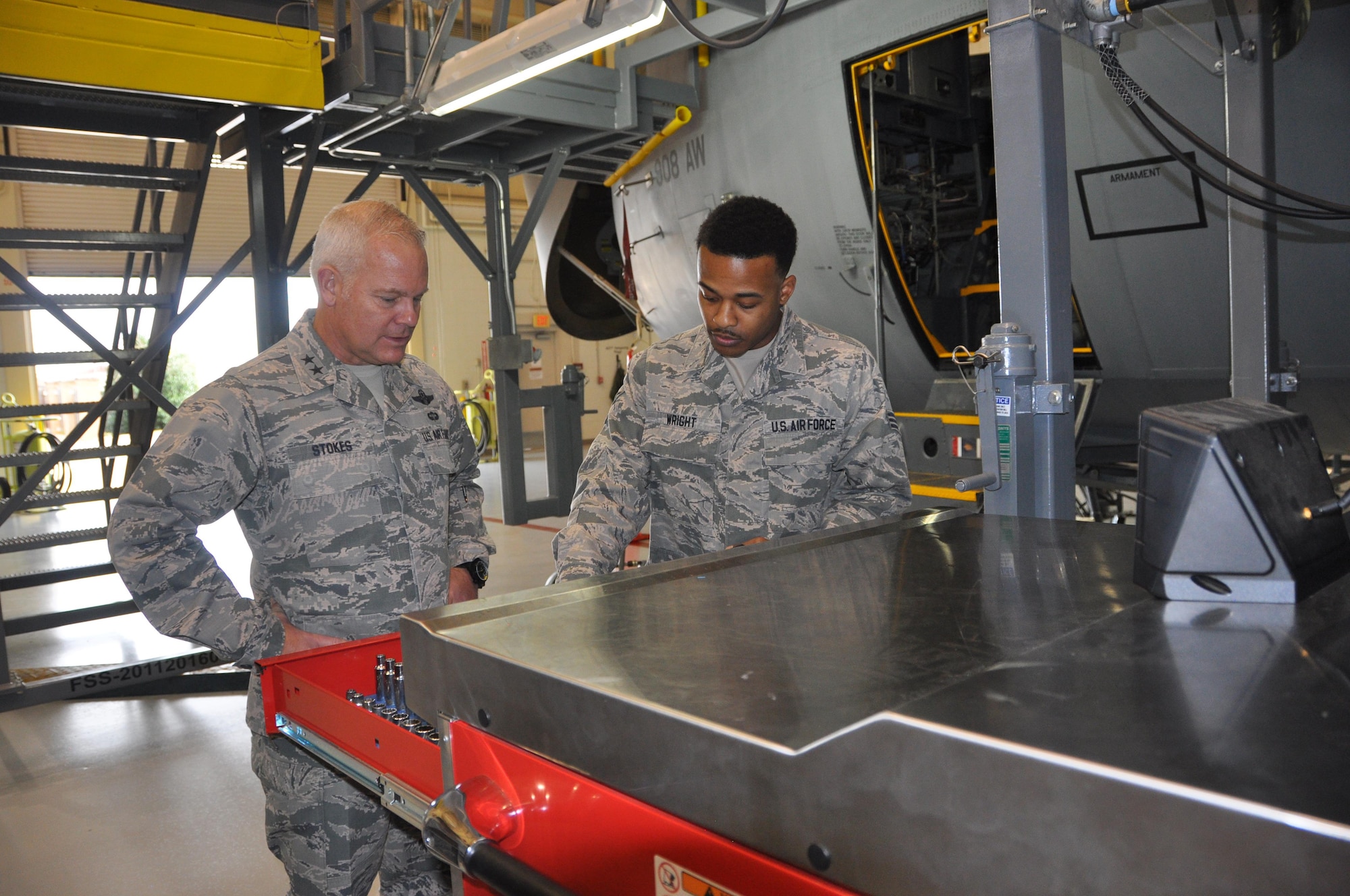 Commanding General of the 22nd Air Force, Maj. Gen. John Stokes, speaks to Senior Airman Irvin Wright of the 908th Maintenance Group during a visit to the 908th Airlift Wing Dec. 3 at Maxwell Air Force Base. Irvin demonstrates how the new smart tool boxes work, requiring indentification and keeping tabs on what is out of the box. (U.S. Air Force photo by Bradley J. Clark)