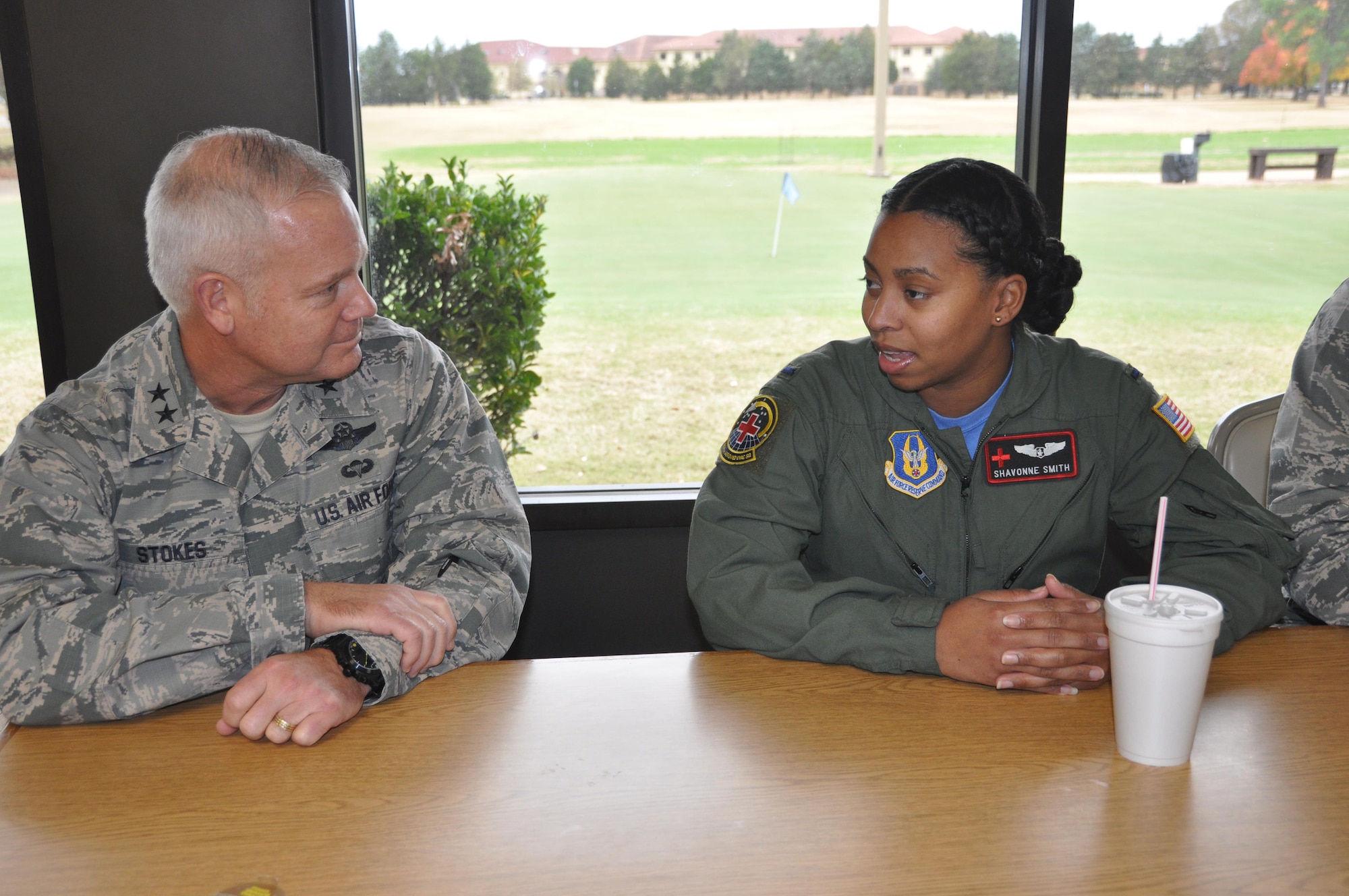 Commanding General of the 22nd Air Force, Maj. Gen. John Stokes, speaks with 1st Lt. Shavonne Smith, member of the Company Grade Officers Club while joing the club for a mentoring lunch Dec. 3 at Maxwell Air Force Base. Stokes came back to Maxwell to spend time with his old unit, the 908th Airlift Wing during the December Unit Training Assembly. (U.S. Air Force photo by Bradley J. Clark)