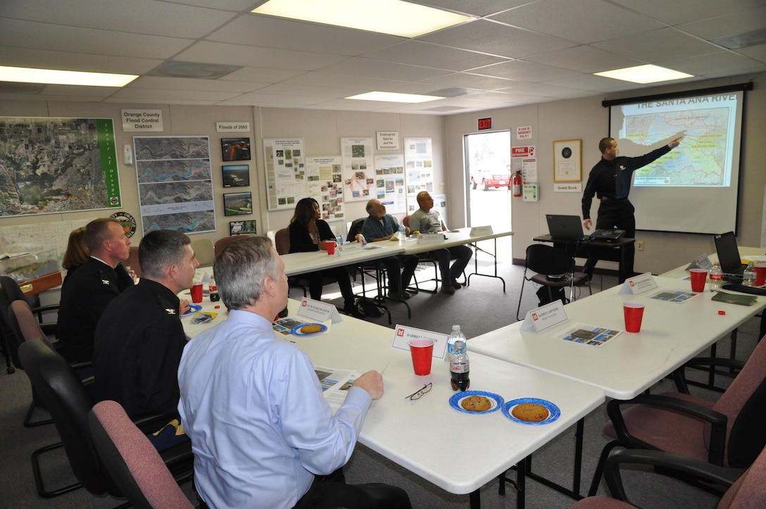 Damien Lariviere, the Los Angeles District project manager for the Santa Ana River Mainstem project, briefs Col. Pete Helmlinger (2nd from right at bottom) about issues and upcoming phases of construction at the Prado Dam Visitor Center in Corona, California, Jan. 18.