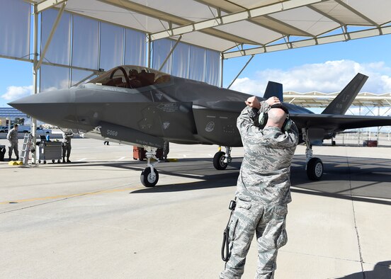 Staff Sgt. Emiliano Canales, 62nd Aircraft Maintenance Unit crew chief, marshals an F-35 Lightning II after landing Jan. 24, 2017, at Luke Air Force Base, Ariz. The 62nd AMU is integrating Airmen from the 61st AMU with Lockheed Martin maintenance personnel. (U.S. Air Force photo by Senior Airman James Hensley)