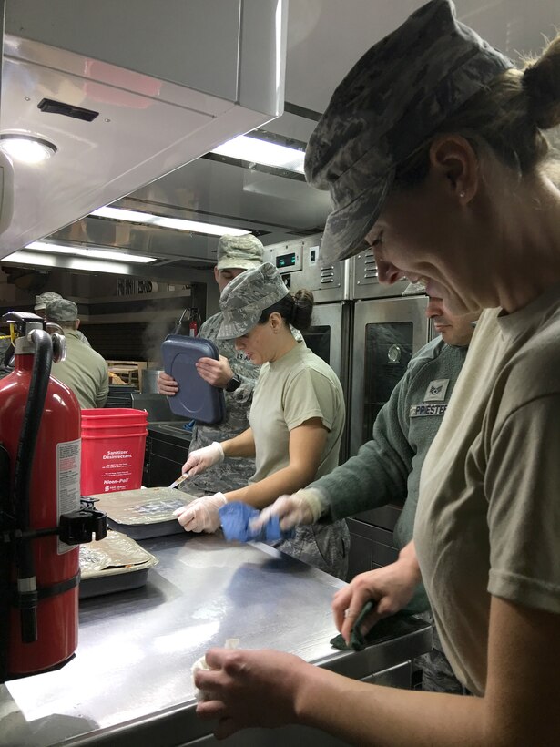 Pennsylvania Air National Guardsmen from the 193rd Special Operations Services Squadron, Middletown, Pa., along with fellow Guard troops from throughout the country, prepare food Jan. 18, 2017, for thousands of Soldiers and Airmen supporting the 58th Presidential Inauguration in Washington, D.C. Crowd management, traffic control, emergency services, and communication and ceremonial duties were a few of the inaugural missions assigned to the Guardsmen while in D.C. (U.S. Air National Guard photo by 2nd Lt. Susan Penning/Released)    