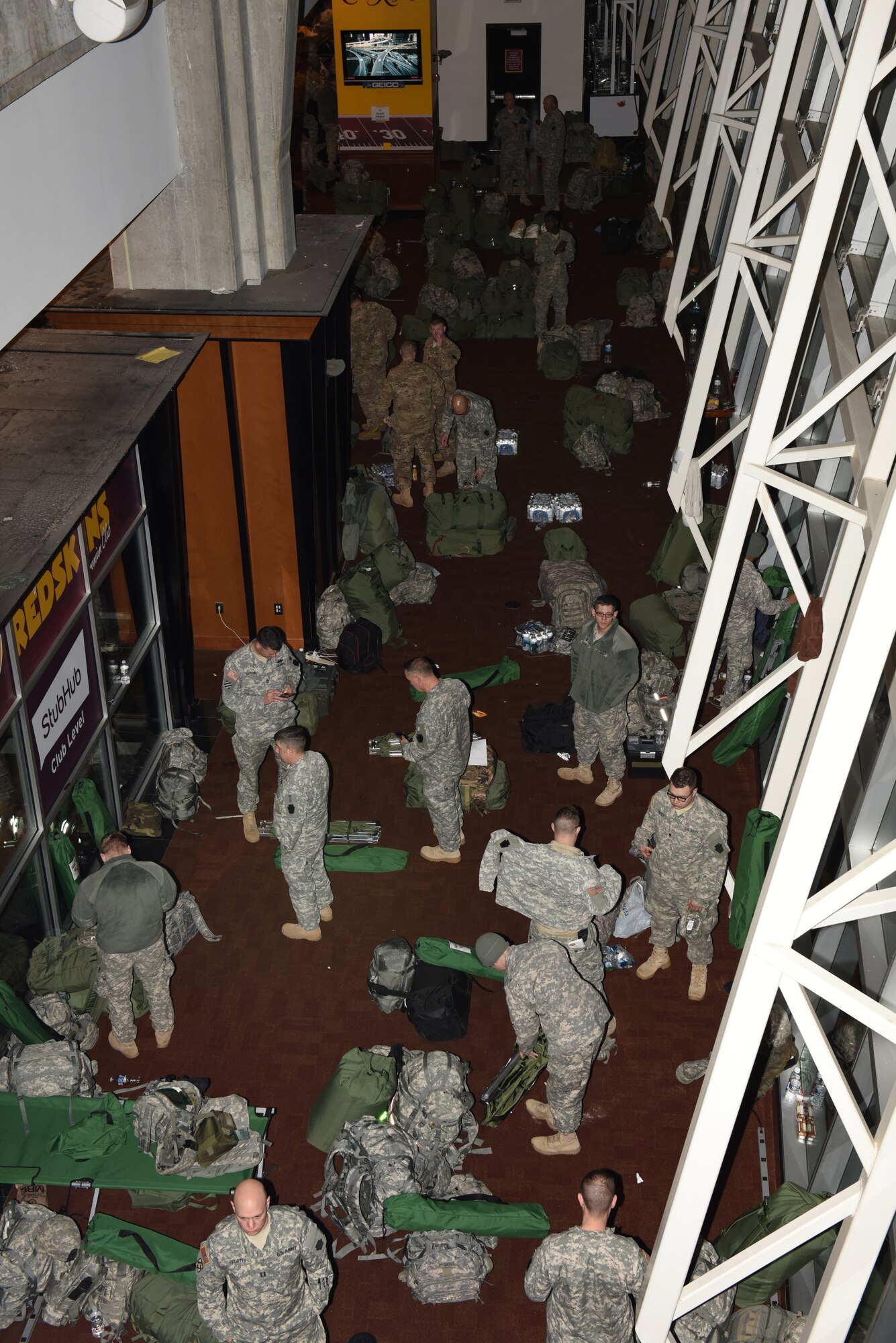 Pennsylvania National Guardsmen pack their gear Jan. 21, 2017, at FedEx Field in Washington, D.C., after performing their duties at the 58th Presidential Inauguration. More than 1,000 Soldiers and Airmen from the Commonwealth joined more than 7,000 troops from around the country, arriving at the nation's capitol to help support a safe, secure inauguration experience for the American public. (U.S. Air National Guard photo by 2nd Lt. Susan Penning/Released) 
