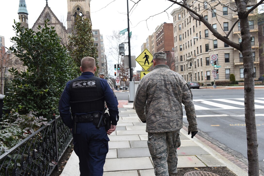 Pennsylvania National Guardsmen and Washington, D.C., Metropolitan police work together Jan. 20, 2017, on the streets of D.C. to support and safe and secure 58th Presidential Inauguration experience for the American public. (U.S. Air National Guard photo by 2nd Lt. Susan Penning/Released) 