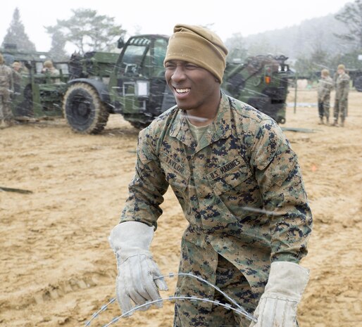 U.S. Marine Corps Pfc. Jason Taylor, a combat engineer with Marine Wing Support Squadron (MWSS) 171, sets up concertina wire during exercise Kamoshika Wrath 17-1 at the Japan Ground Self-Defense Force’s Haramura Maneuver Area in Hiroshima, Japan, Jan. 22, 2017. The exercise is a biannual, unit-level training exercise that is primarily focused on establishing a forward operating base and providing airfield operation services. The squadron plans to establish and maintain an aviation ground support center, forward operating base, unit movement control center and tactical motor pool. (U.S. Marine Corps photo by Cpl. Donato Maffin)