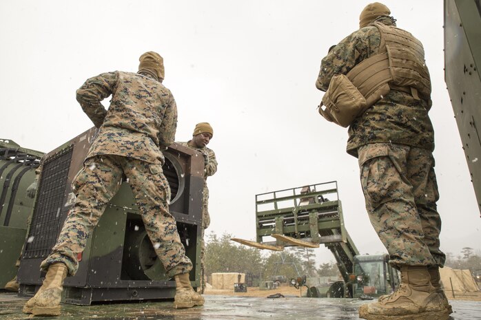 U.S. Marines with Marine Wing Support Squadron (MWSS) 171 prepare an Environmental Control Unit to be off-loaded from a seven-ton medium tactical vehicle replacement during exercise Kamoshika Wrath 17-1 at the Japan Ground Self-Defense Force’s Haramura Maneuver Area in Hiroshima, Japan, Jan. 22, 2017. The exercise is a biannual, unit-level training exercise that is primarily focused on establishing a forward operating base and providing airfield operation services. The squadron plans to establish and maintain an aviation ground support center, forward operating base, unit movement control center and tactical motor pool. (U.S. Marine Corps photo by Cpl. Donato Maffin)