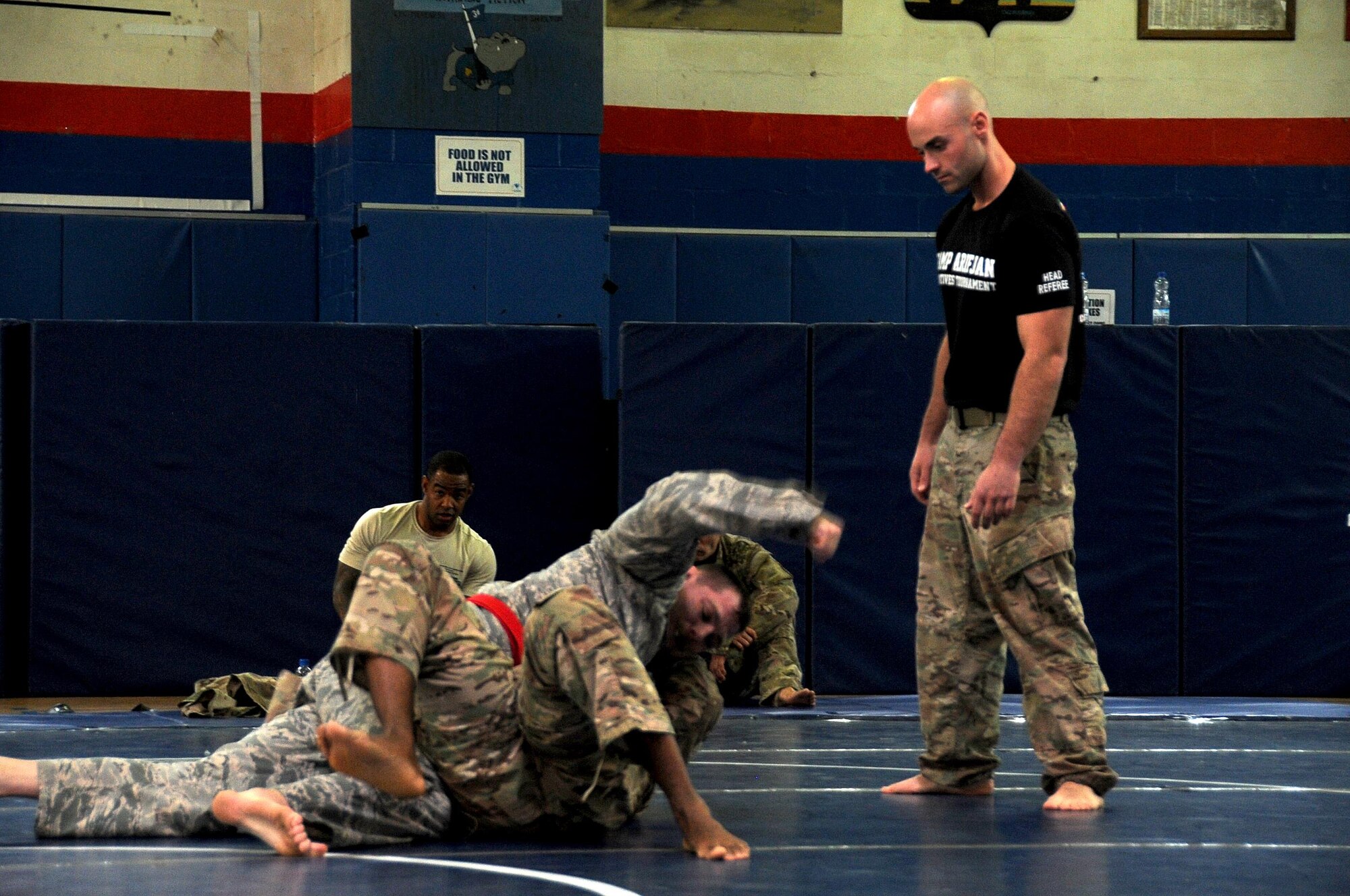 Staff Sgt. Jeffrey Zastrow, 386th Expeditionary Medical Group bio-environmental technician, left, attacks his opponent during a combatives tournament hosted by the 368th Engineering Battalion at an undisclosed location in Southwest Asia January 22, 2017. Zastrow trained and fought to become the winner of the heavy weight division. (U.S. Air Force photo/Tech. Sgt. Kenneth McCann)