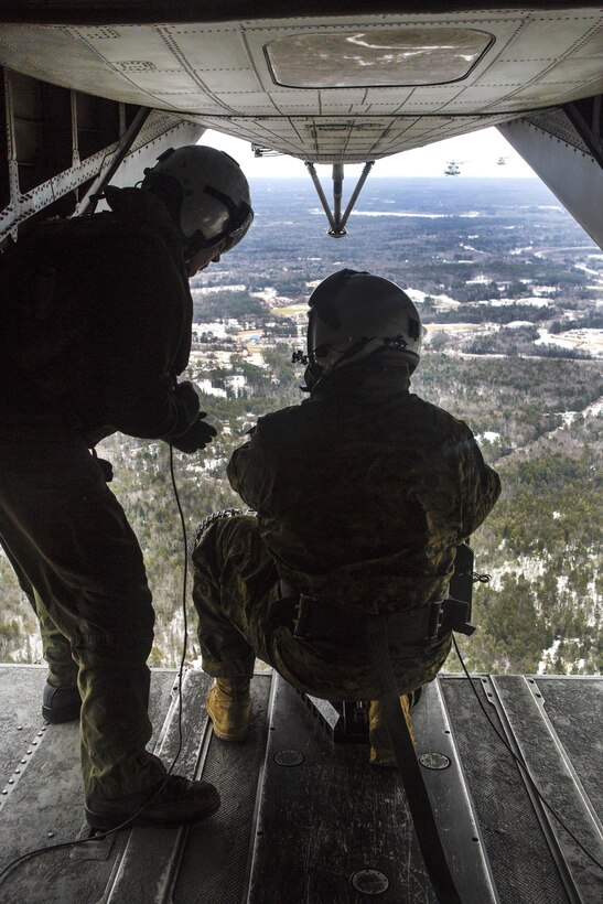 Marine Corps Sgt. Maj. Brian S. Alsleben, right, speaks to Sgt. Adam Lindsey before participating in a live-fire event as part of Exercise Frigid Condor over Fort Drum, N.Y., Jan. 23, 2017. Marine Corps photo by Lance Cpl. Jered T. Stone