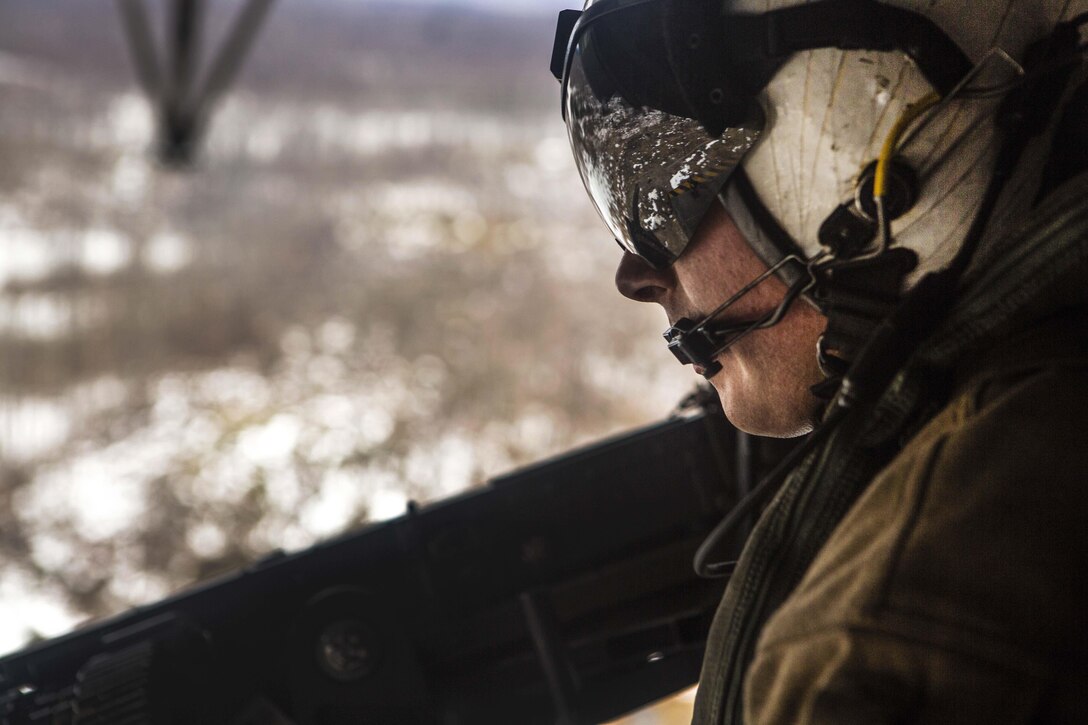 Marine Corps Sgt. Adam Lindsey observes training before participating in a live-fire event as part of Exercise Frigid Condor over Fort Drum, N.Y., Jan. 23, 2017. Marine Corps photo by Lance Cpl. Jered T. Stone