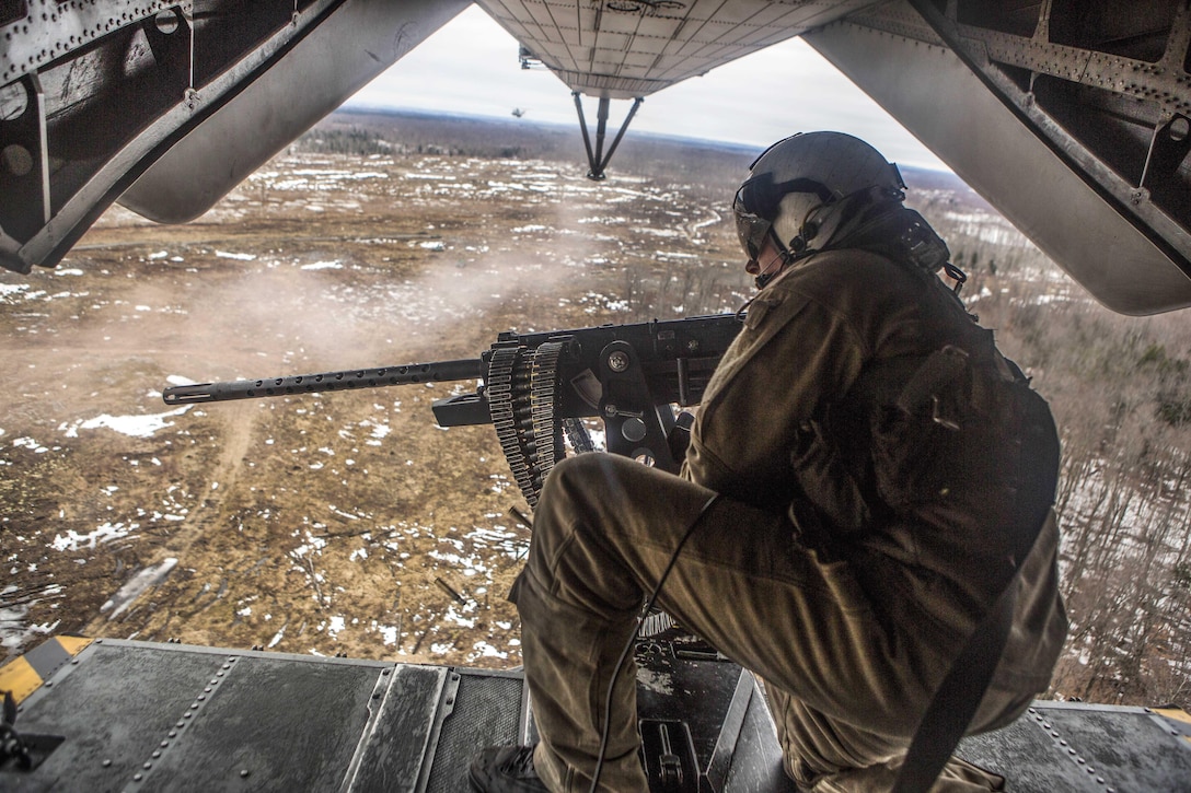 Marine Corps Sgt. Adam Lindsey fires a .50-caliber machine gun during Exercise Frigid Condor over Fort Drum, N.Y., Jan. 23, 2017. Marine Corps photo by Lance Cpl. Jered T. Stone