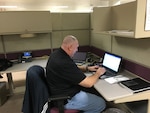 Donnie Thompson, of the DLA Organizational Management directorate tests out the wireless network during the 2016 Continuity of Operations program.