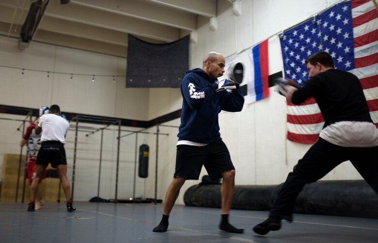 COLORADO SPRINGS, Colo. – Tech. Sgt. Rosey Summerville, 21st Force Support Squadron fitness NCO in charge, trains Isaac Johnson, Colorado Springs professional boxer, and other boxers at the Colorado Springs Judo Center, Colorado Springs, Colo., Jan. 20, 2017. Summerville is a decorated former competitive boxer with two Air Force titles and one Armed Force Golden Glove championship under his belt. (U.S. Air Force photo by Airman 1st Class Dennis Hoffman)