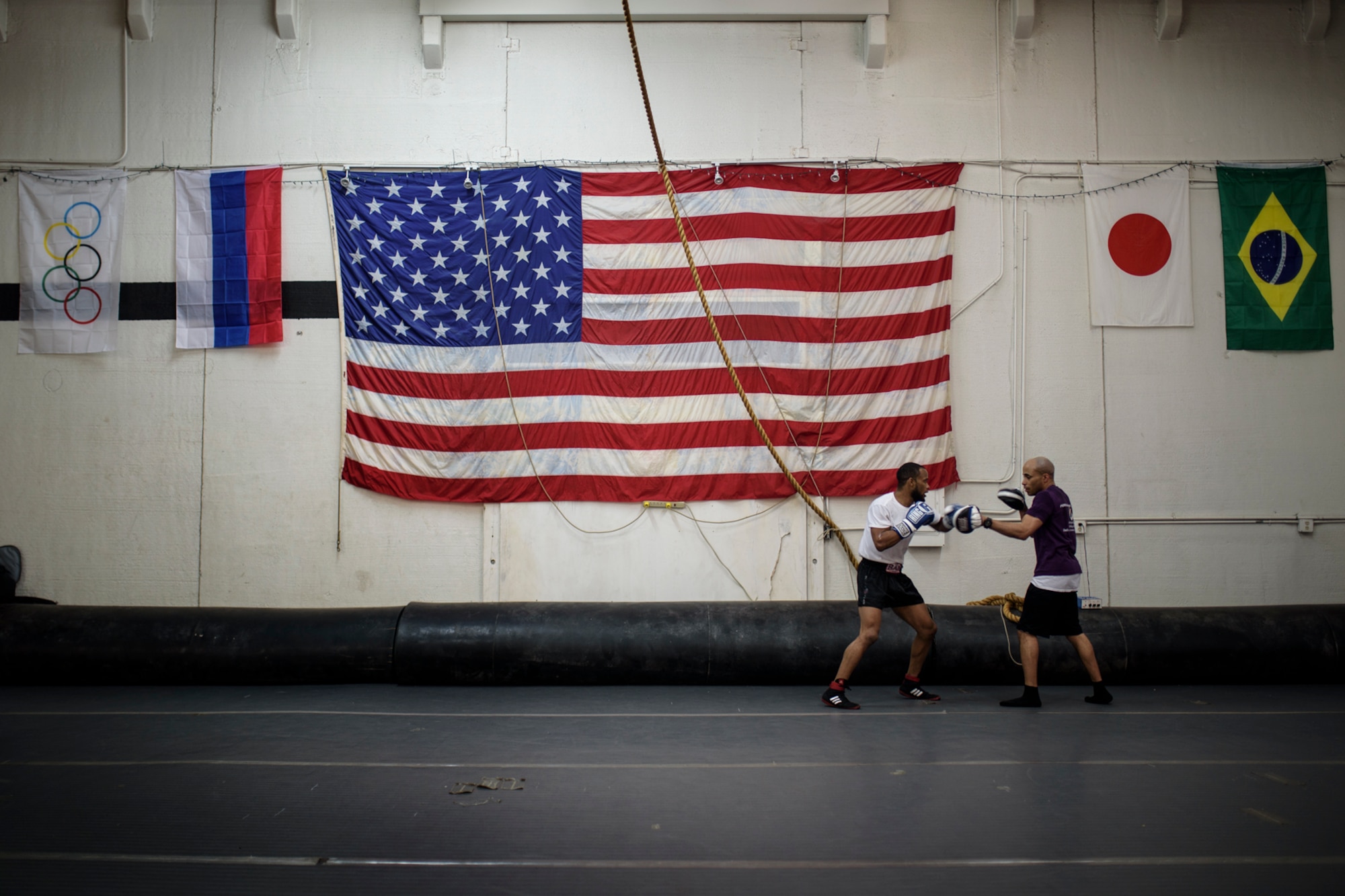 COLORADO SPRINGS, Colo. – Tech. Sgt. Rosey Summerville, 21st Force Support Squadron fitness NCO in charge (right), coaches a boxer at the Colorado Springs Judo Center, Colorado Springs, Colo., Jan. 20, 2017. Summerville preserves his boxing legacy by reaching out to Airmen and the Colorado Springs community to train youth in boxing. (U.S. Air Force photo by Airman 1st Class Dennis Hoffman)
