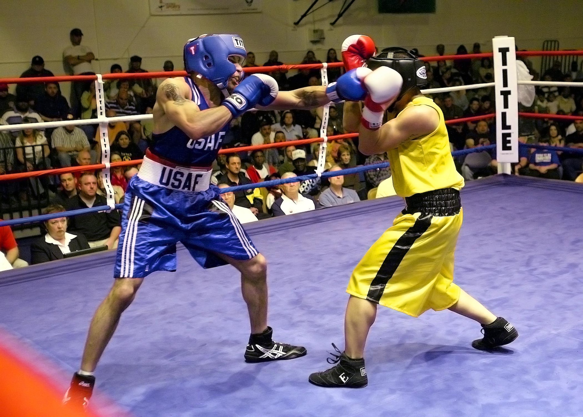 LACKLAND AIR FORCE BASE, Texas – Staff Sgt. Rosey Summerville from Shaw Air Force Base, South Carolina, throws a left jab at Army Capt. Christopher Munar from Fort Carson, Colo., during the U.S. Armed Forces Boxing Championship finals March 9, 2007, at Bennett Fitness Center on Lackland Air Force Base, Texas. Summerville won the gold medal by decision, 32-11, in the featherweight class. (U.S. Air Force photo by Robbin Cresswell)