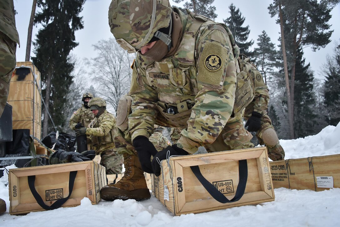 Soldiers unpack 120 mm mortar rounds at the 7th Army Training Command’s Grafenwoehr Training Area in Germany, Jan. 24, 2017. Army photo by Gertrud Zach