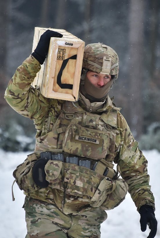 A soldier carries a case with 120 mm mortar rounds to prepare for a mortar live-fire training exercise at the 7th Army Training Command’s Grafenwoehr Training Area in Germany, Jan. 24, 2017. Army photo by Gertrud Zach