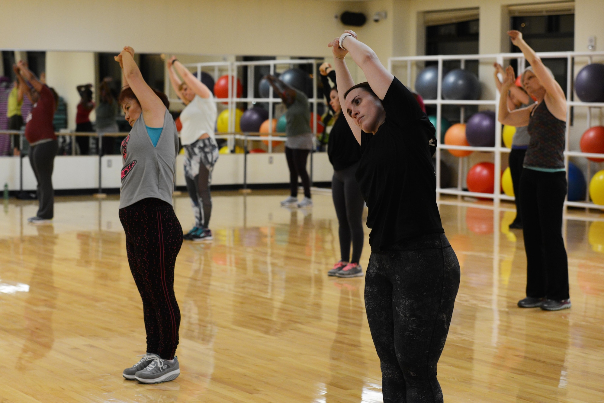 Participants stretch at the end of a Zumba group-exercise class at the Elmendorf Fitness Center at Joint Base Elmendorf-Richardson, Alaska, Jan. 17, 2017. All group-exercise classes last approximately an hour and welcome participants of all skill levels who are 16 years older with base access.