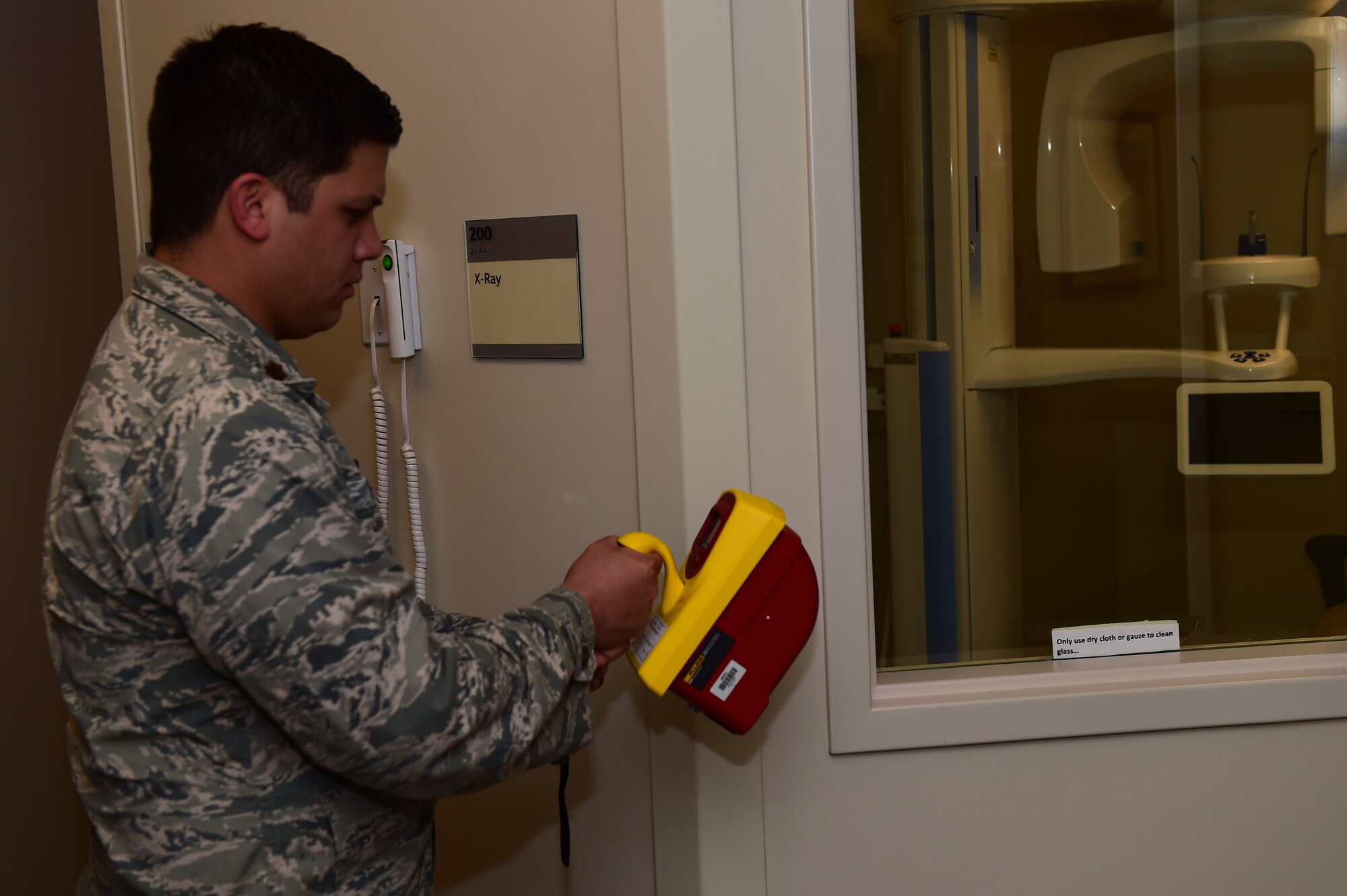 Maj. Alfred Felipe, 460th Medical Group bioenvironmental element chief, checks the radiation levels Jan. 19, 2016, in the soon-to-open 460th MDG dental clinic on Buckley Air Force Base, Colo. As a bioenvironmental officer, Felipe provides occupational health support, ensures drinking water quality and provides emergency response. (U.S. Air Force photo by Airman 1st Class Gabrielle Spradling/Released)