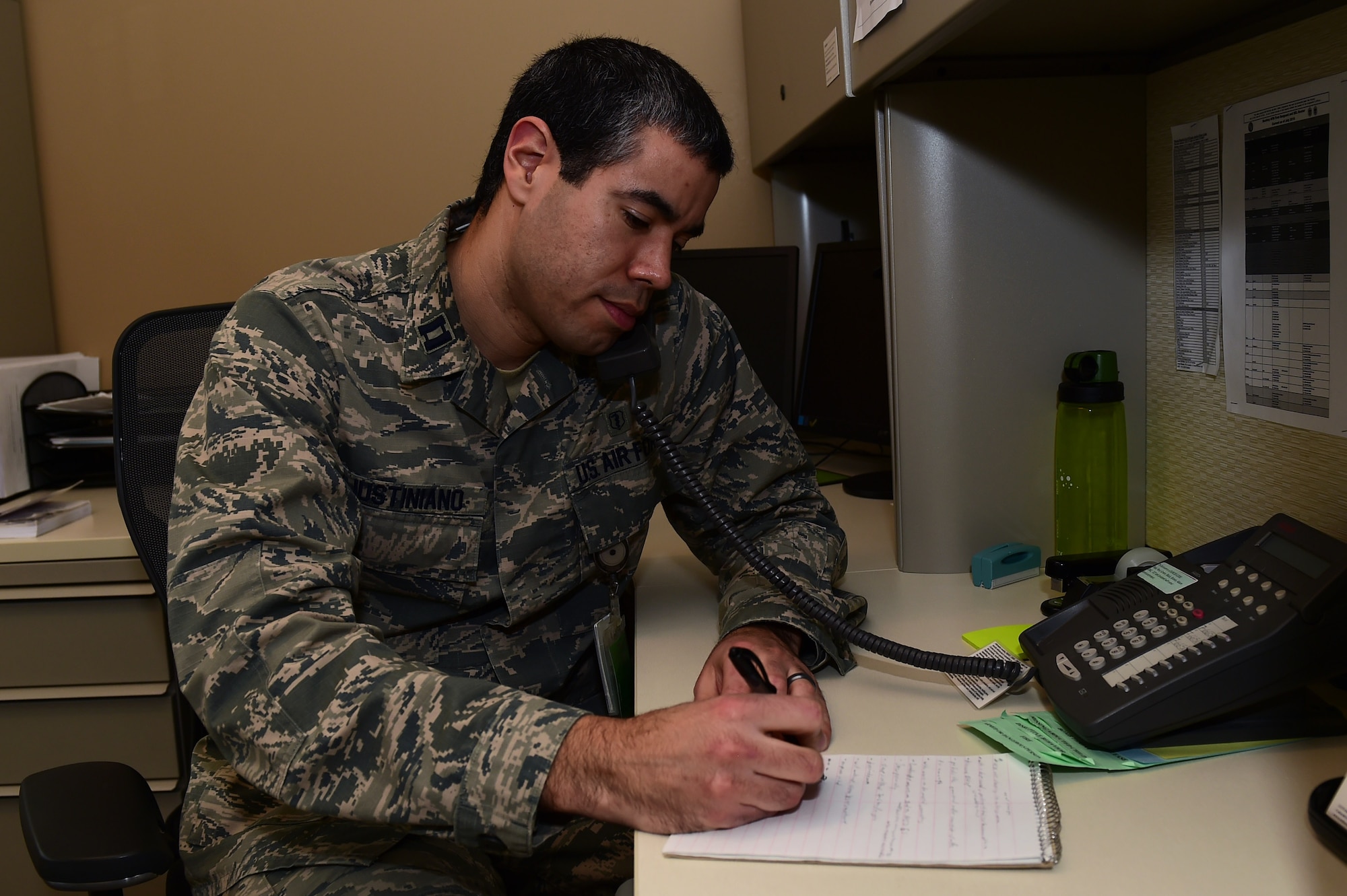 Capt. Robert Justiniano, 460th Medical Group Air Force Alcohol and Drug Abuse Prevention and Treatment manager, participates in a patient telephone conference, Jan. 20, 2017, at the Veterans Affairs Joint Venture Buckley Clinic in Aurora, Colo. The ADAPT program promotes health, readiness and wellness by prevention and treatment of substance abuse. (U.S. Air Force photo by Airman 1st Class Gabrielle Spradling/Released)