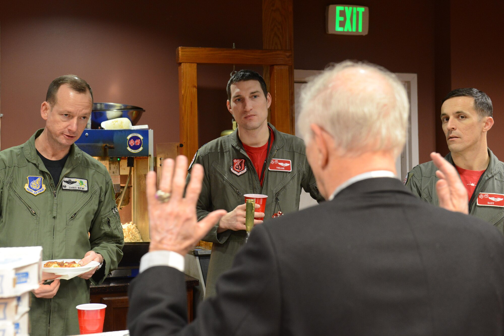 Donald W. Sheppard, a retired Air Force Major General, speaks to Air Force Col. Christopher Niemi, 3rd Wing commander, and other pilots at the 90th Fighter Squadron at Joint Base Elmendorf-Richardson, Alaska, Jan. 20, 2017. Sheppard, a pilot with more than 5,000 flying hours, and 247 combat missions during the Vietnam War, spoke about his experiences in the Air Force and provided insight into how the military can keep improving.