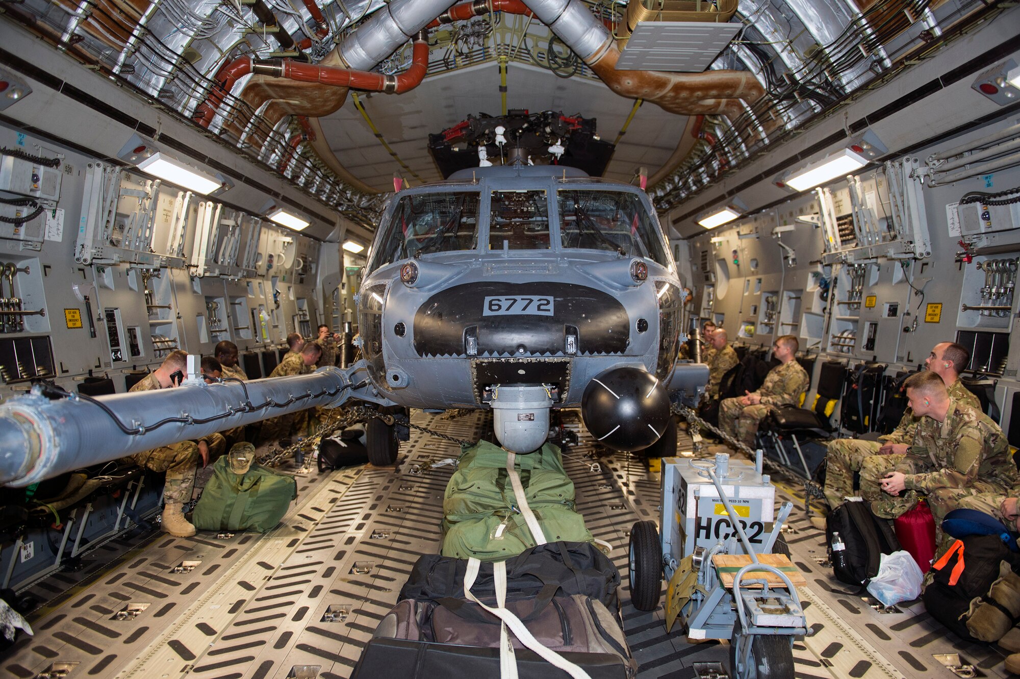 Passengers and an HH-60G Pave Hawk from the 41st Rescue Squadron wait for takeoff on a C-17 Globemaster III, Jan. 19, 2017, at Moody Air Force Base, Ga. The 41st RQS Airmen will utilize their expertise in personnel recovery, treatment and extraction in Southeast Europe in support of Operation Inherent Resolve. (U.S. Air Force photo by Airman 1st Class Greg Nash)