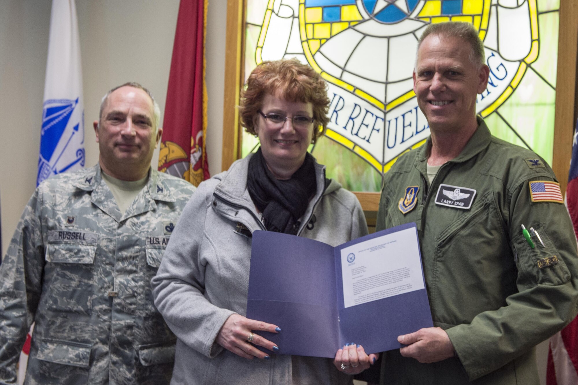 Colonel Larry Shaw, 434th Air Refueling Wing commander, and Colonel Scott Russell, 434th Mission Support Group commander, present Jill Marconi-Pyclik with a certificate of recognition at Grissom Air Reserve Base, January 17, 2017. Marconi-Pyclik will be traveling to D.C. to accept the official award in March. (U.S. Air Force photo/Tech. Sgt. Benjamin Mota) 