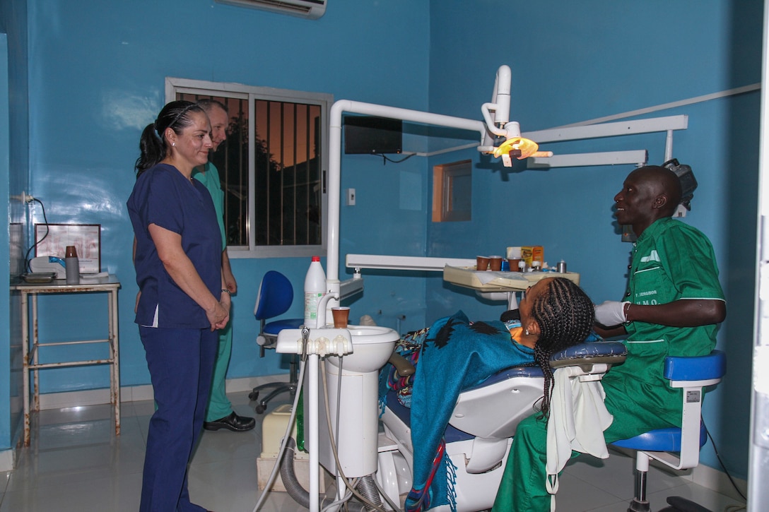U.S. Army Reserve Master Sgt. Jacqueline Fortin, a dental specialist from the 332nd Medical Brigade in Nashville, Tenn., and Senegalese dentist Frederic Senghor, prepare a young patient for a tooth extraction during Medical Readiness Training Exercise 17-1 at La Sante des Armees Hospital in Dakar, Senegal, Jan. 12, 2017. MEDRETE is a combined effort between the Senegalese government, U.S. Army Africa, the U.S. Army Reserve 332nd Medical Brigade in Nashville, Tenn., and the Vermont Air National Guard. MEDRETE 17-1 is the first in a series of medical readiness training exercises that U.S. Army Africa is scheduled to facilitate within various countries in Africa, and serves as an opportunity for the partnered militaries to hone and strengthen their general surgery and trauma skills while reinforcing the partnership between the countries. The mutually beneficial exercise brings together Senegalese military and U.S. Army medical professionals to foster cooperation while conducting medical specific tasks.
