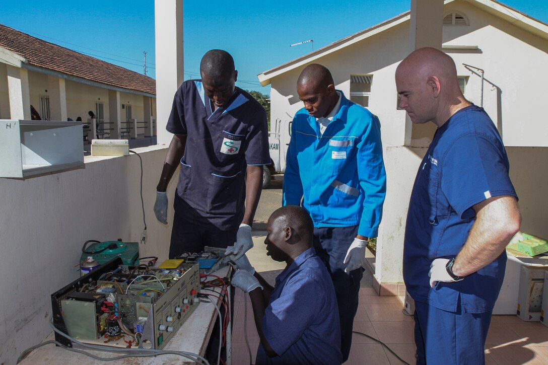 U.S. Army Reserve Chief Warrant Officer David Bostic, biomedical technician, from the 332nd Medical Brigade in Nashville, Tenn., observes Senegalese biomedical technician Sgt. Delhie Olbnye, teach technicians how to repair electrosurgical equipment during Medical Readiness Training Exercise 17-1 at La Sante des Armees Hospital in Dakar, Senegal, Jan. 12, 2017. MEDRETE is a combined effort between the Senegalese government, U.S. Army Africa, the U.S. Army Reserve 332nd Medical Brigade in Nashville, Tenn., and the Vermont Air National Guard. AFRICOM’s MEDRETEs hosted by United States Army-Africa pair small teams of military medical professionals from the U.S. with participating African partner nations to train alongside and share best practices in trauma and surgical medicine. U.S. personnel; benefit by providing medical care in a forward and austere environment; African partners develop closer relations ships with medical personnel, and local populations receive additional medical care. 