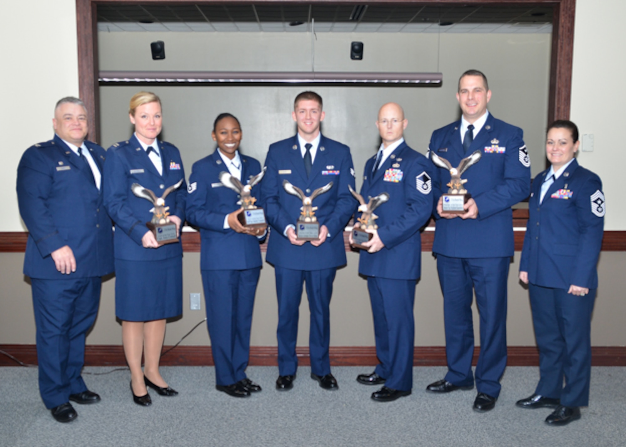 Col. Ken Eaves, 131st Bomb Wing Commander (left) and 131st Command Chief Master Sgt. Jessica Settle (right) recognize winners of the wing’s 2016 Outstanding Airman of the Year awards during the Missouri Air National Guard’s OAY Banquet held at Whiteman Air Force Base, Missouri, Jan. 6. From left to right, winners are: Capt. Amy Cottrell, 131st Medical Group, Company Grade Officer of the Year; Staff Sgt. Heather Campbell, 157th Air Communications Squadron, Noncommissioned Officer of the Year; Senior Airman Travis Hugh, 157th ACOMS, Airman of the Year; Master Sgt. Thomas DuMont Jr., 157th Combat Operations Squadron, Senior NCO of the Year; and Master Sgt. Matthew Kuensting, 239th Combat Operations Squadron, First Sergeant of the Year. Not pictured is Field Grade Officer of the Year Maj. David Thomas, 157th COS. In subsequent competition, Campbell received the all-new Missouri Air National Guard Command Chief’s Award, and DuMont took honors as top SNCO of the year across the Missouri Air National Guard, and will advance to compete at the Air National Guard Outstanding Airman of the Year level. (U.S. Air National Guard photo by Staff Sgt. Colton Elliott)