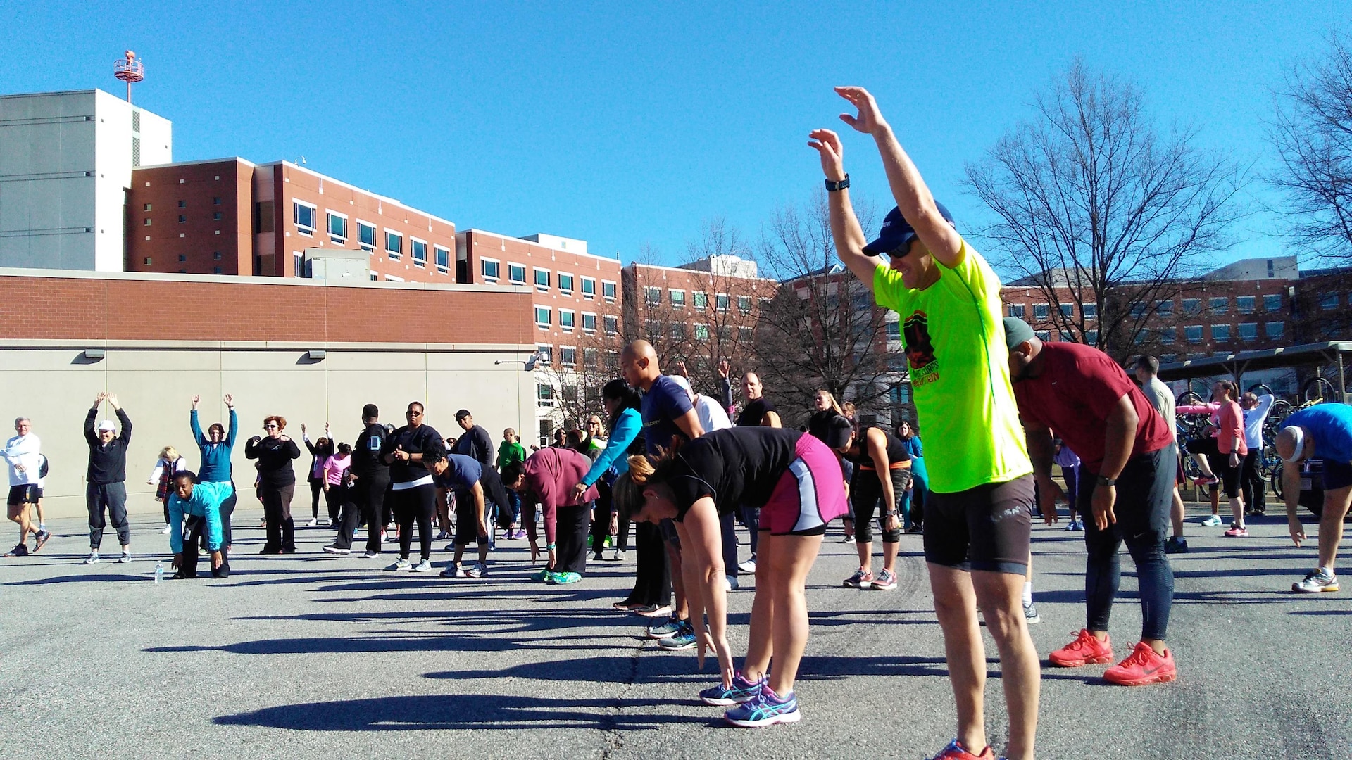 Walkers and runners do warmup exercises before the Frosty Bear walk-run, Jan. 25 at the McNamara Headquarters Complex, Fort Belvoir, Virginia.