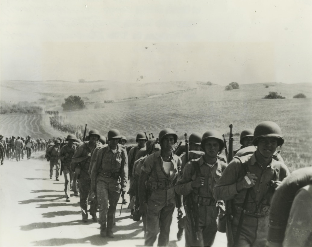Marines from 9th Marine Regiment marching aboard Camp Pendleton in September 1942; 9th Marines was the first organized unit to occupy the new camp, Camp Joseph H. Pendleton.  9th Marines and its attachments marched from Camp Elliott (San Diego, CA) to the new Marine Corps Base in four days starting on 1 September 1942.