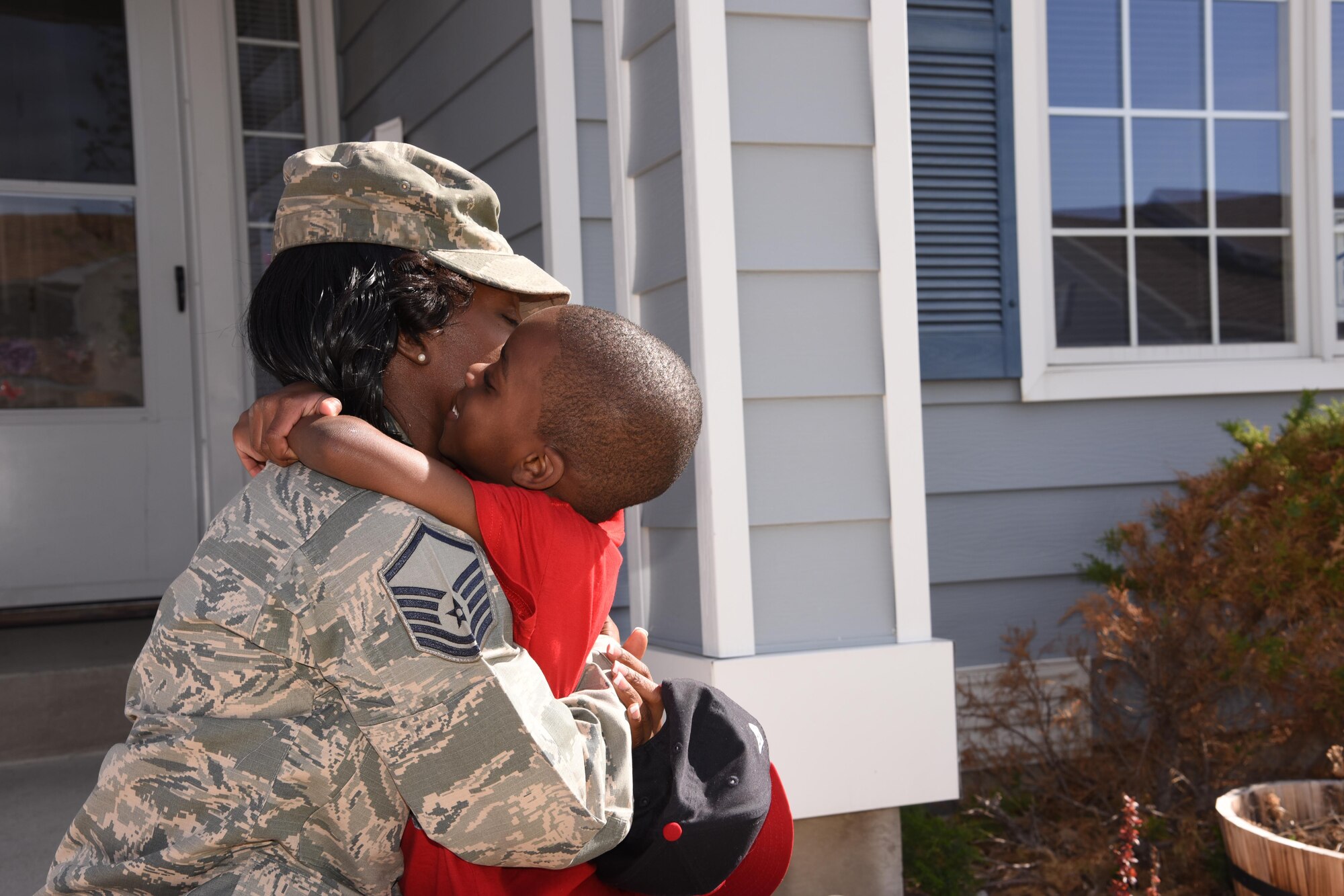U.S. Air Force Master Sgt. Lateisha Nunn hugs her son after picking him up from school at Malmstrom Air Force Base Mont., May 5, 2016. Malmstrom leadership recently participated in a conference with leadership from Global Strike Command, focusing on improvements to quality of life issues. Air Force Global Strike Command is dedicating 2017 to Airmen and their families and focusing on where Airmen live, learn, play, pray and receive care. (U.S. Air Force photo/Senior Airman Jaeda Tookes)