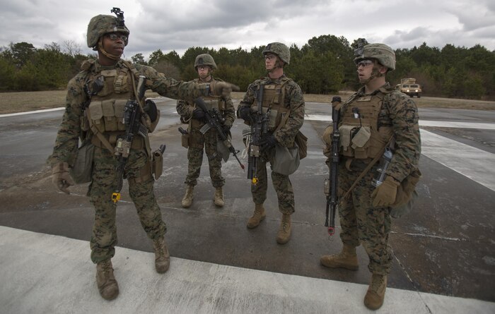 Pfc. Robert Haughn, Company A, Fleet Anti-Terrorism Security Team, Marine Corps Security Force Regiment, prepares to use simulated, non-lethal ammunition on role-players causing a disturbance around a secured compound during a company-level operational readiness exercise aboard Naval Weapons Station Yorktown, Va., Jan. 17, 2017, in preparation for the platoon’s deployment to Spain. The Marines from 1st platoon, Company A, were evaluated on their abilities to accomplish their mission during this four-day exercise, which was to reinforce embassies around the world and to ensure the compounds they occupy are secured.(Official U.S. Marine Corps photo by Sgt. Calvin Shamoon/ Released)