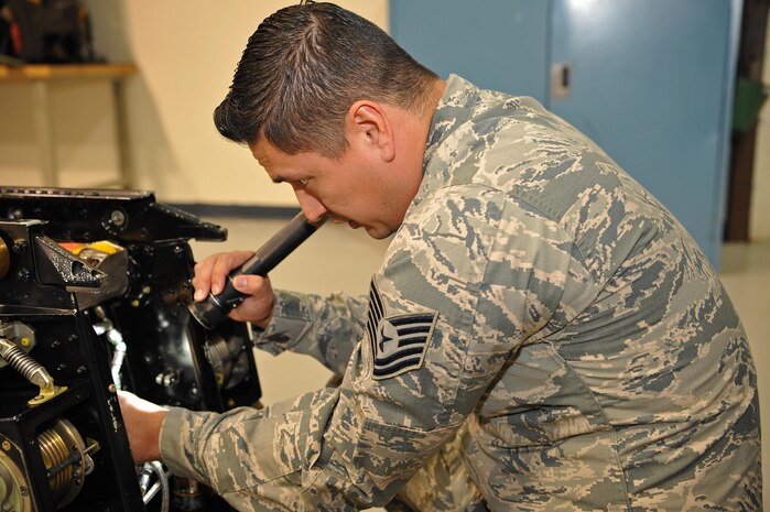 Tech. Sgt. Jonathan Sandlin, 9th Maintenance Squadron assistant section chief, inspects the hoses on a U-2 Dragon Lady ejection seat Jan. 23, 2017 at Beale Air Force Base, Calif. The hoses carry explosive pressure, which allows the pilot to eject from the aircraft. (U.S. Air Force photo/Airman Tristan D. Viglianco)
