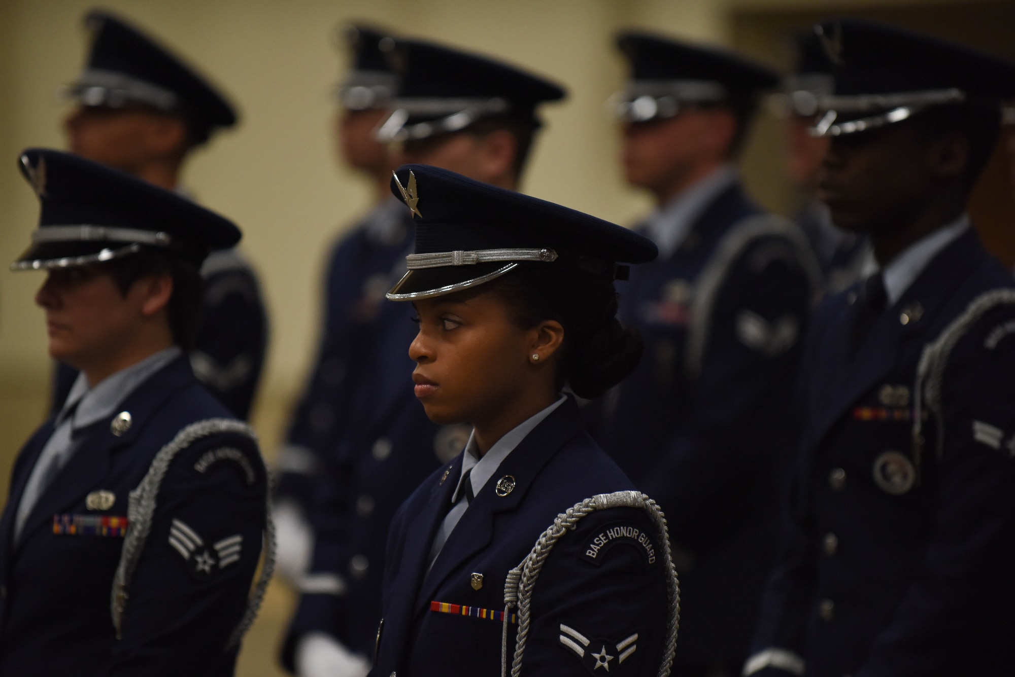 Airman 1st Class Asia Tull, 2nd Dental Squadron dental assistant, stands in formation with her fellow honor guard graduates at Barksdale Air Force Base, La., Jan. 23, 2017. The silver rope on the left shoulder signifies someone is an honor guardsman. (U.S. Air Force photo/Airman 1st Class Stuart Bright)