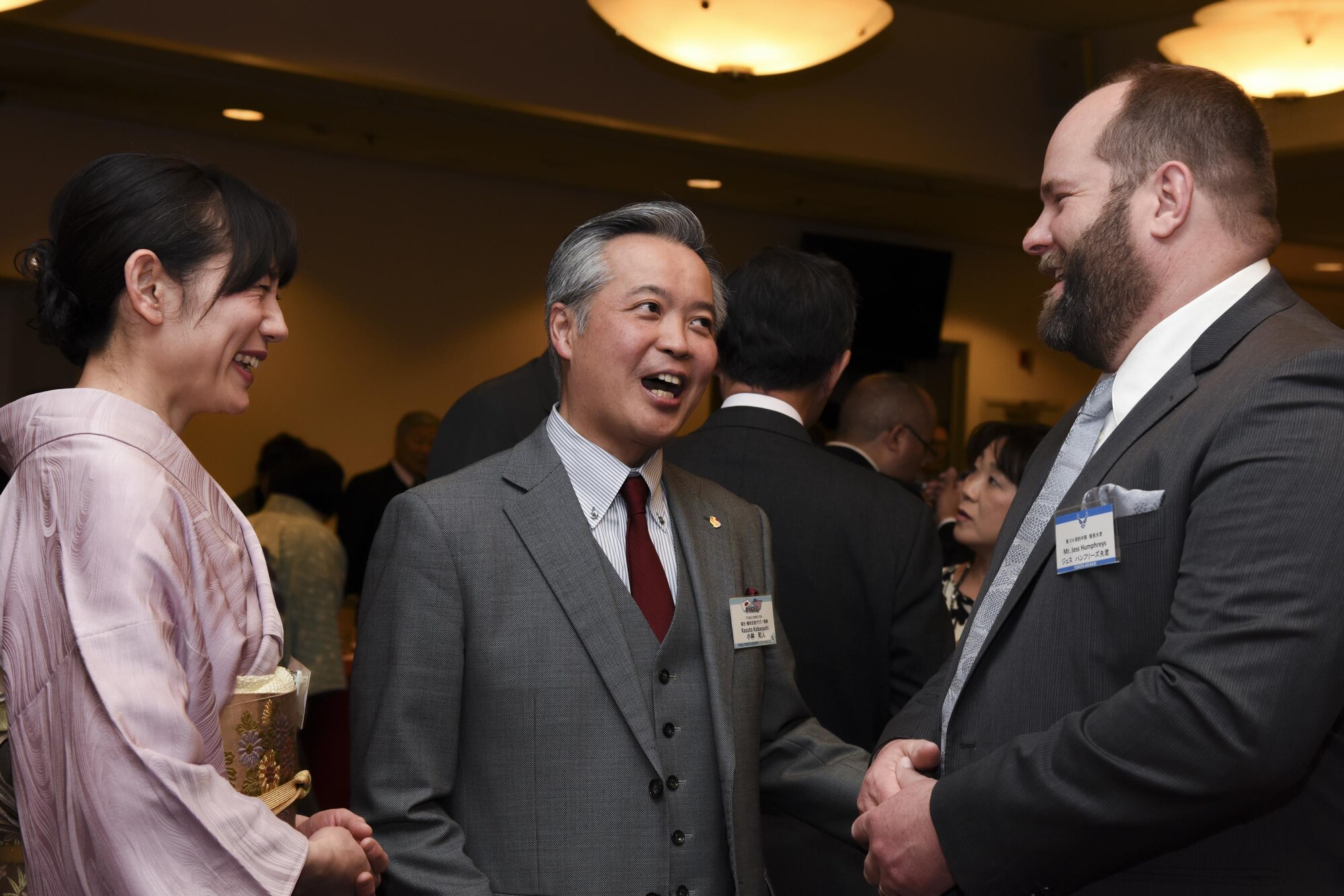 Kazuto Kobayashi, center, a member of Fussa-Yokota Goodwill Exchange Club director, and his wife talk to Jess Humphreys, husband of Maj. Sarah Humphreys, 374th Contracting Squadron commander, during the Joint New Year’s Party at Yokota Air Base, Japan, Jan. 21, 2017. The event was hosted by Col Kenneth Moss, commander of the 374th Airlift Wing, and the president from each of the seven friendship clubs from Fussa City, Akiruno City, Mizuho Town, Hamura City, Musashimurayama City, Ome City and Akishima City to strengthen the friendship between Yokota Air Base and each of the local communities. (U.S. Air Force photo by Machiko Arita)