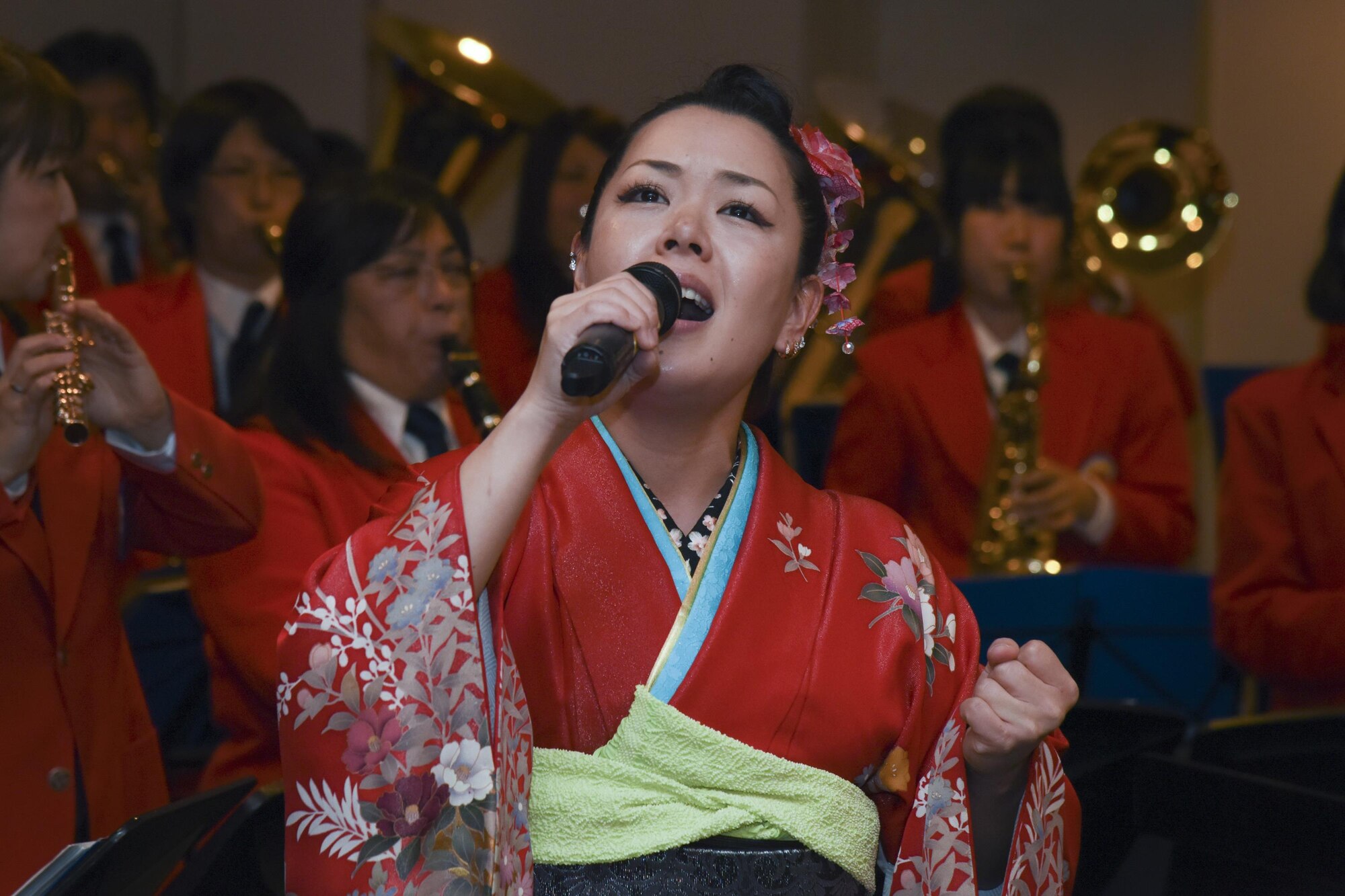 Miki Takahashi, a member of the Mizuho-Yokota Friendship Association, sings the American and Japanese national anthems during the Joint New Year’s Party at Yokota Air Base, Japan, Jan. 21, 2017. The event was hosted by Col Kenneth Moss, commander of the 374th Airlift Wing, and the president from each of our seven friendship clubs from Fussa City, Akiruno City, Mizuho Town, Hamura City, Musashimurayama City, Ome City and Akishima City to strengthen the friendship between Yokota Air Base and each of the local communities. (U.S. Air Force photo by Machiko Arita)