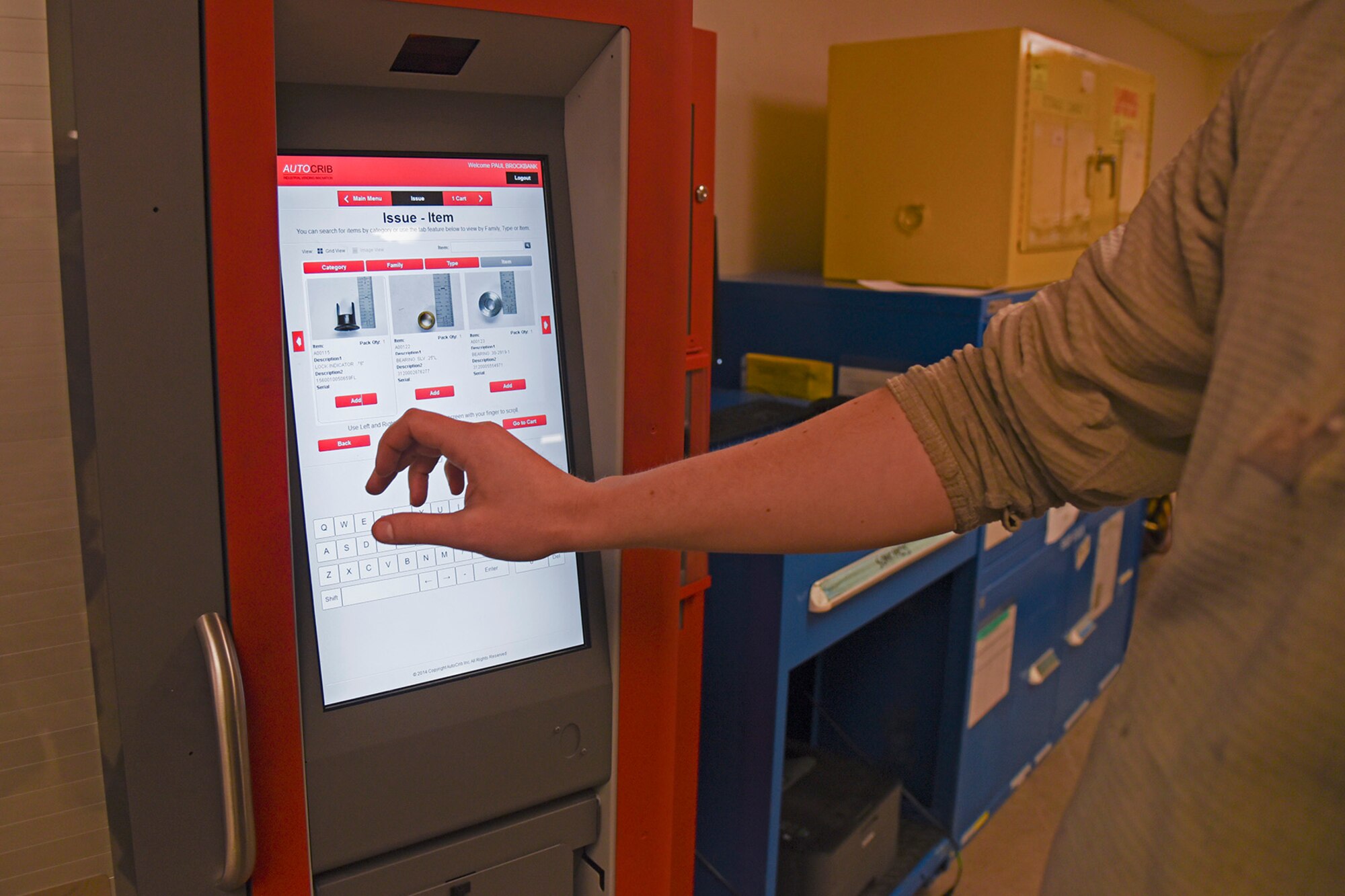 Senior Airman Paul Brockbank, 92nd Maintenance Squadron periodic inspection journeyman, searches for a fastener using the 92nd MXS PE support section RoboCrib Jan. 20, 2017, at Fairchild Air Force Base, Wash. The RoboCrib currently holds more than 100 different types of fasteners and has the potential to hold nearly every piece of bench stock within the 92nd MXS PE support section’s inventory. (U.S. Air Force photo/Senior Airman Mackenzie Richardson)