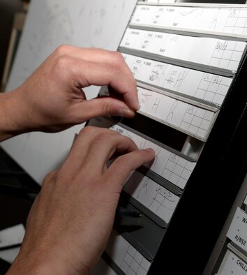 Senior Airman Jonell Sanchez, an air traffic controller assigned to the 28th Operations Support Squadron, transfers beacon codes during a training simulation at Ellsworth Air Force Base, S.D., Jan. 25, 2017. The Ellsworth approach display shows aircraft entering the airspace and allows the controllers to communicate with the pilots. (U.S. Air Force photo by Airman 1st Class Donald C. Knechtel)