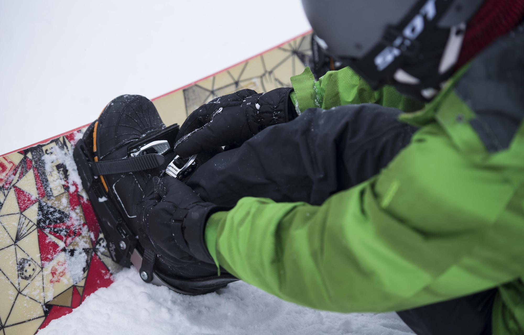Senior Airman Max Dunevant, 92nd Air Refueling Wing commander support staff, buckles his boot before snowboarding down the mountain during a trip with Outdoor Recreation Dec. 18, 2016 , at 49 Degrees North Ski Resort, Wash. Trips through Outdoor Recreation are offered at a very small charge because of the Recharge for Resiliency program. The R4R program provides supplemental funding to programs that help with resilience, retention and recruitment. (U.S. Air Force photo/Airman 1st Class Sean Campbell)