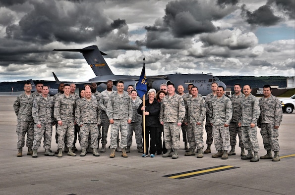 Gertrude “Gertie” Grosskopf, 721st Aerial Port Squadron Fleet Service supervisor and Air Transportable Galley and Lavatory manager, takes a photo with member of the 721 APS on the flightline of Ramstein Air Base, Germany. Gertie is retiring after serving the Air Force for more than 39 years. During her time, she became known as the go-to person for the ATGLs not only in the squadron but for all of Air Mobility Command. (Courtesy Photo)