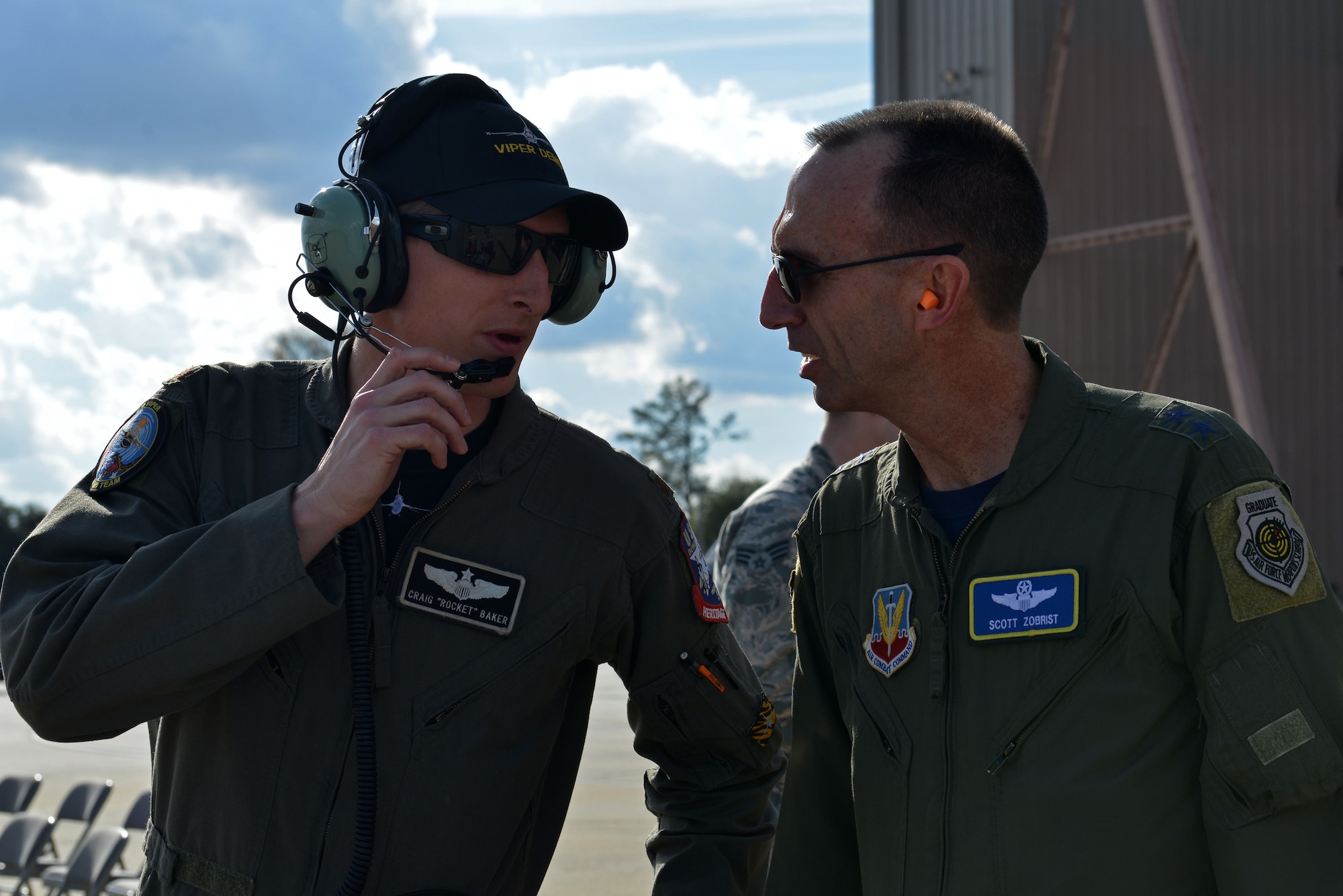 U.S. Air Force Maj. Gen. Scott Zobrist(right), 9th Air Force commander, speaks with Maj. Craig Baker(left), former F-16 Viper Demonstration Team pilot, during the third level of certification at Shaw Air Force Base, S.C., Jan. 20, 2017. The process involves four levels of certification (group commander, wing commander, numbered air force and ACC commander) and showcases the upcoming year’s demonstration, as well as certifies the new demo team pilot on the maneuvers. (U.S. Air Force photo by Airman 1st Class Destinee Sweeney)
