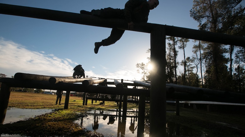 Cpl. Thomas Cornell climbs an obstacle on the obstacle course during an event known as advanced course preparation training at Marine Corps Base Camp Lejeune, N.C., Jan. 23, 2017. The event was a seven-mile course that served as an initial performance assessment and tested the Marines on basic knowledge and skills. It is a way for the Marines to know which skills to refine before they begin a military occupational specialty specific advanced course. Cornell is with 2nd Battalion, 8th Marine Regiment, 2nd Marine Division. 