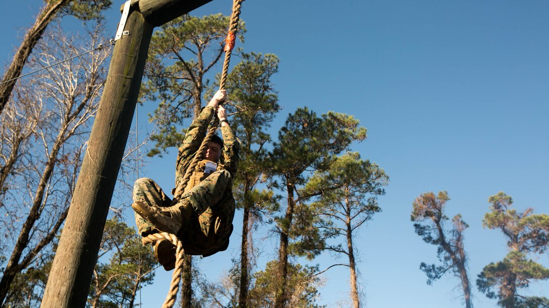 A Marine with 2nd Battalion, 8th Marine Regiment, 2nd Marine Division climbs a rope on the obstacle course during an event known as advanced course preparation training at Marine Corps Base Camp Lejeune, N.C., Jan. 23, 2017. The event was a seven-mile course that served as an initial performance assessment and tested the Marines on basic knowledge and skills. It is a way for the Marines to know which skills to refine before they begin a military occupational specialty specific advanced course. 