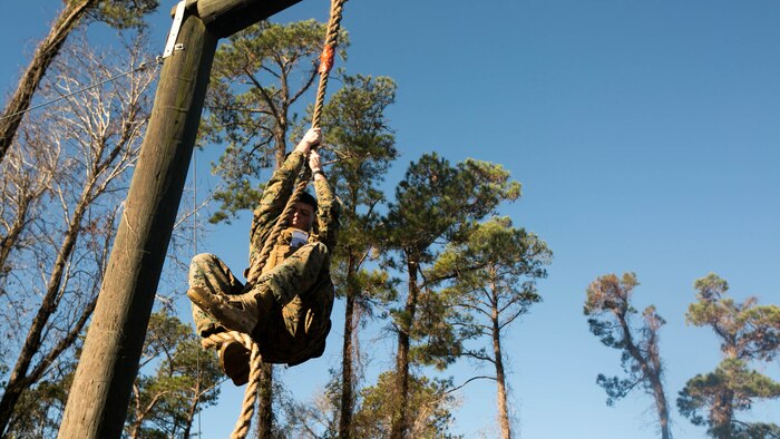 A Marine with 2nd Battalion, 8th Marine Regiment, 2nd Marine Division climbs a rope on the obstacle course during an event known as advanced course preparation training at Marine Corps Base Camp Lejeune, N.C., Jan. 23, 2017. The event was a seven-mile course that served as an initial performance assessment and tested the Marines on basic knowledge and skills. It is a way for the Marines to know which skills to refine before they begin a military occupational specialty specific advanced course. 