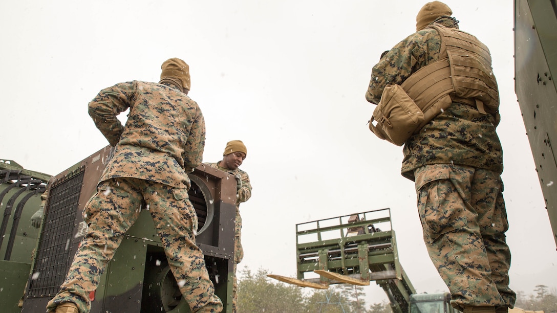 U.S. Marines with Marine Wing Support Squadron (MWSS) 171 prepare an Environmental Control Unit to be off-loaded from a seven-ton medium tactical vehicle replacement during exercise Kamoshika Wrath 17-1 at the Japan Ground Self-Defense Force’s Haramura Maneuver Area in Hiroshima, Japan, Jan. 22, 2017. The exercise is a biannual, unit-level training exercise that is primarily focused on establishing a forward operating base and providing airfield operation services. The squadron plans to establish and maintain an aviation ground support center, forward operating base, unit movement control center and tactical motor pool. 