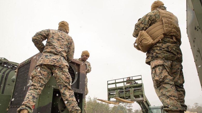 U.S. Marines with Marine Wing Support Squadron (MWSS) 171 prepare an Environmental Control Unit to be off-loaded from a seven-ton medium tactical vehicle replacement during exercise Kamoshika Wrath 17-1 at the Japan Ground Self-Defense Force’s Haramura Maneuver Area in Hiroshima, Japan, Jan. 22, 2017. The exercise is a biannual, unit-level training exercise that is primarily focused on establishing a forward operating base and providing airfield operation services. The squadron plans to establish and maintain an aviation ground support center, forward operating base, unit movement control center and tactical motor pool. 